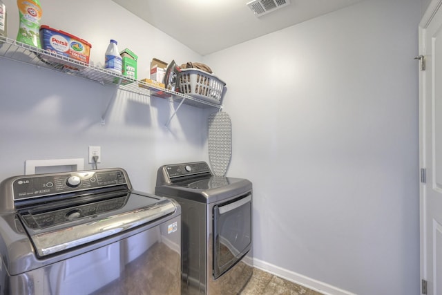 washroom with washer and clothes dryer