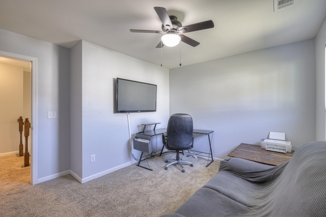 office featuring ceiling fan and light carpet