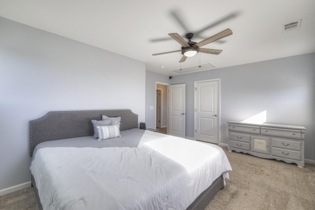 bedroom featuring light carpet and ceiling fan