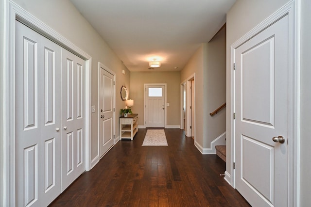 entryway with dark wood-type flooring