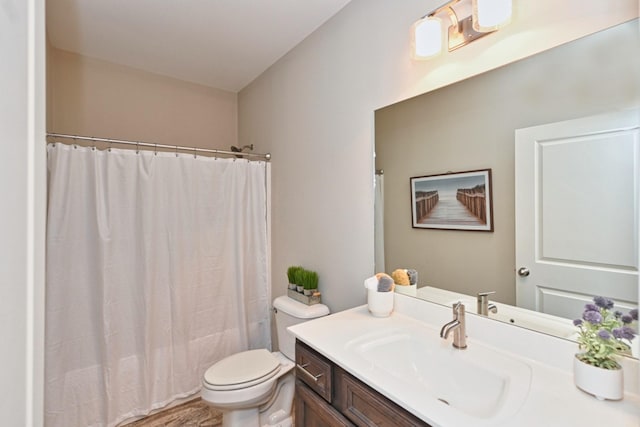 full bathroom featuring vanity, toilet, and shower / tub combo with curtain