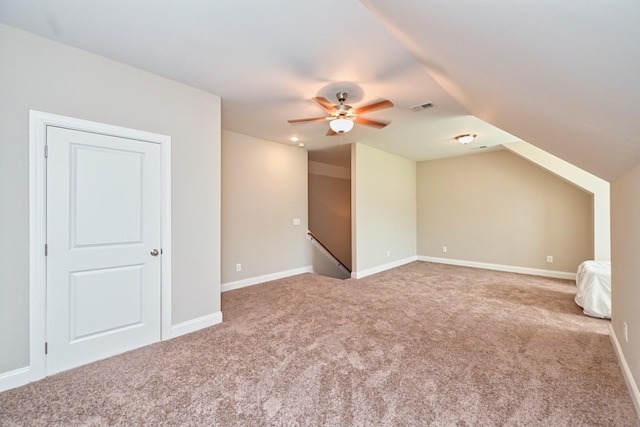 bonus room featuring vaulted ceiling, carpet, and ceiling fan