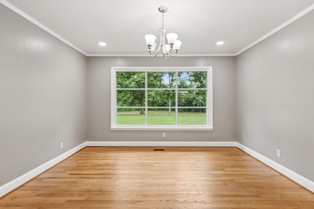 unfurnished dining area with an inviting chandelier, light hardwood / wood-style flooring, and ornamental molding