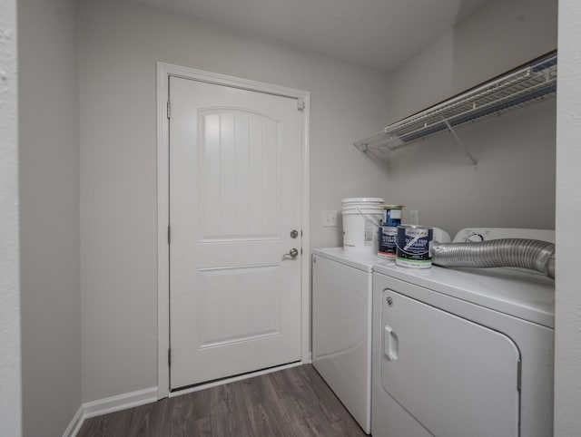 laundry area featuring dark wood-type flooring and washer and dryer