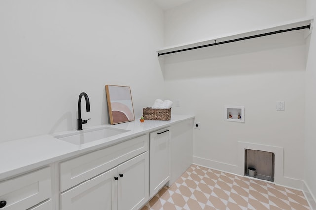 laundry room with cabinets, hookup for an electric dryer, hookup for a washing machine, and sink