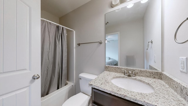 full bathroom featuring shower / bath combination with curtain, vanity, and toilet