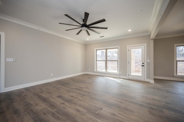 unfurnished room featuring dark wood-type flooring, plenty of natural light, and ornamental molding