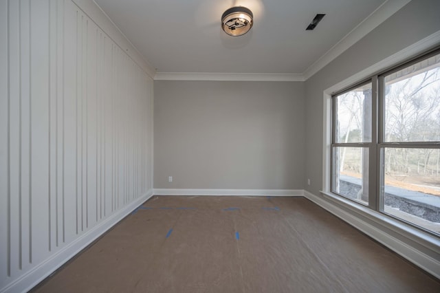 spare room featuring crown molding