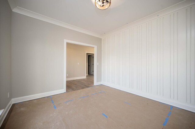 unfurnished room with ornamental molding