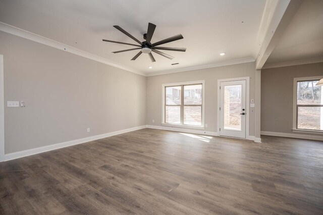 spare room featuring crown molding, dark hardwood / wood-style floors, and ceiling fan