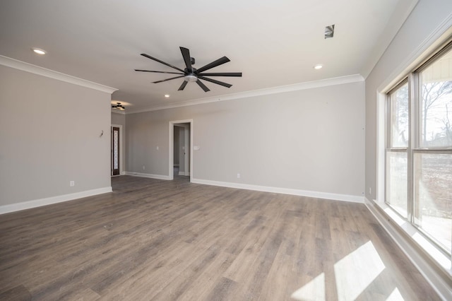 empty room with crown molding, ceiling fan, and wood-type flooring