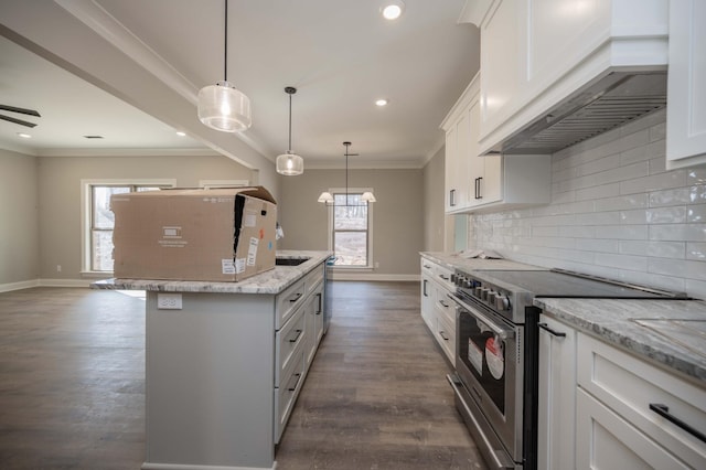 kitchen with an island with sink, white cabinets, decorative light fixtures, stainless steel electric stove, and custom exhaust hood