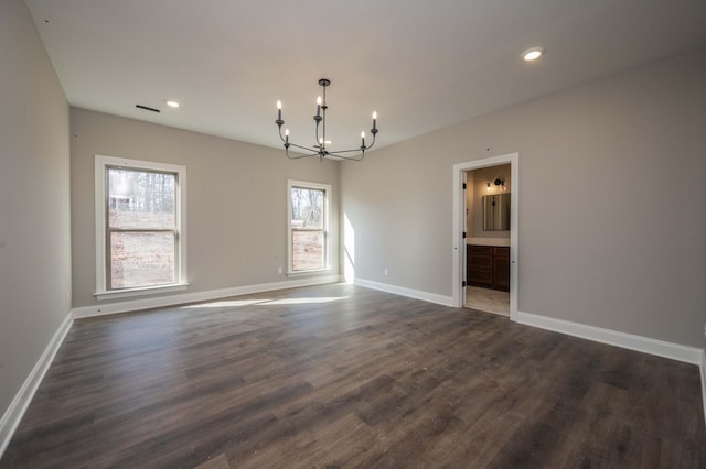 interior space featuring dark hardwood / wood-style flooring and a notable chandelier