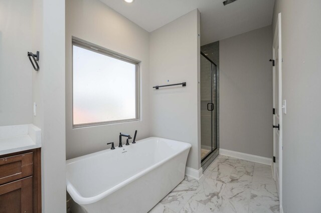 bathroom featuring independent shower and bath and vanity