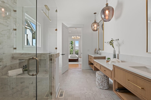 bathroom with walk in shower and vanity