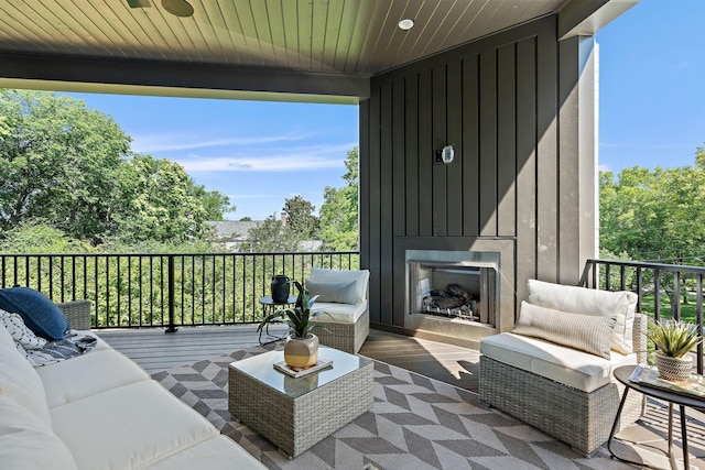 exterior space featuring an outdoor living space with a fireplace