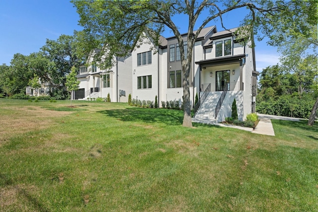 rear view of house with a lawn