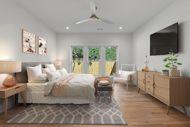 bedroom featuring light hardwood / wood-style floors and ceiling fan