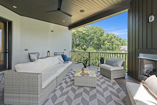 view of patio featuring an outdoor living space and ceiling fan