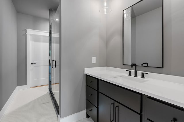 bathroom featuring vanity and a shower with shower door