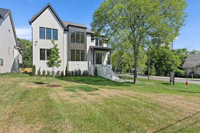 view of front facade with a front lawn