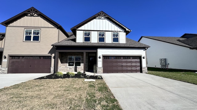 view of front of house with a garage and a front lawn