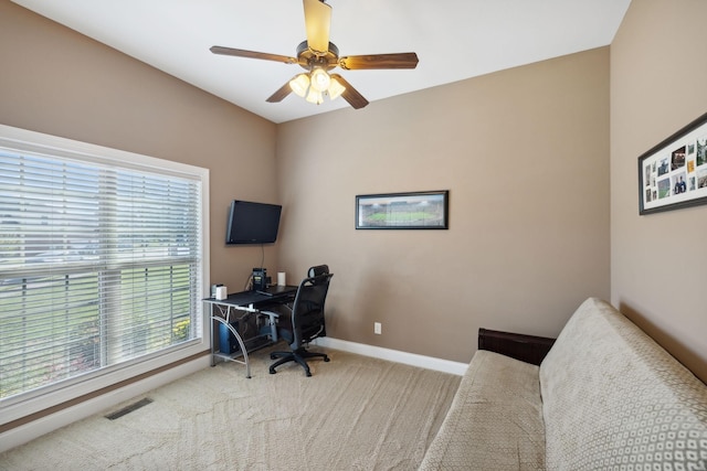 office space with carpet floors and ceiling fan