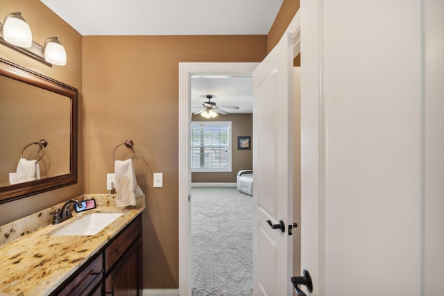 bathroom with ceiling fan and vanity