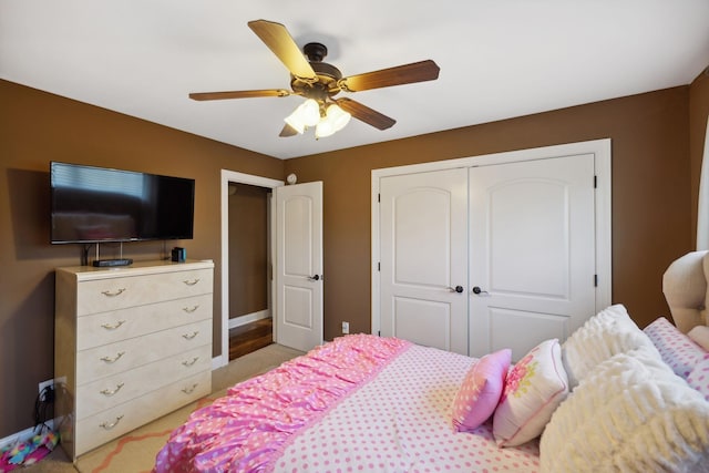 bedroom featuring ceiling fan and a closet