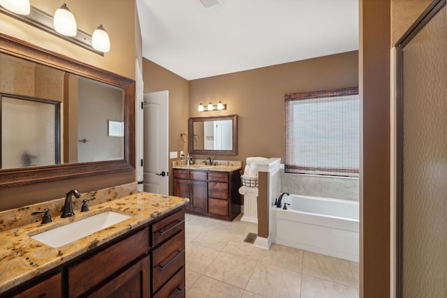 bathroom with vanity, independent shower and bath, and tile patterned flooring