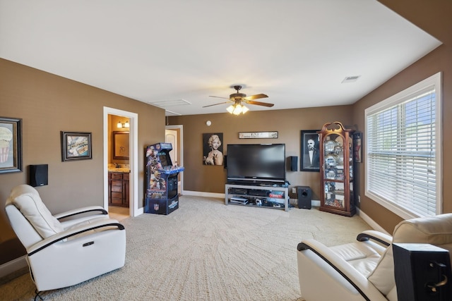 living room featuring carpet floors and ceiling fan