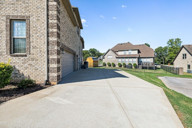 view of side of property with a garage and a yard