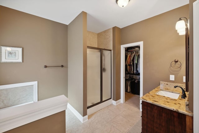 bathroom with vanity and walk in shower