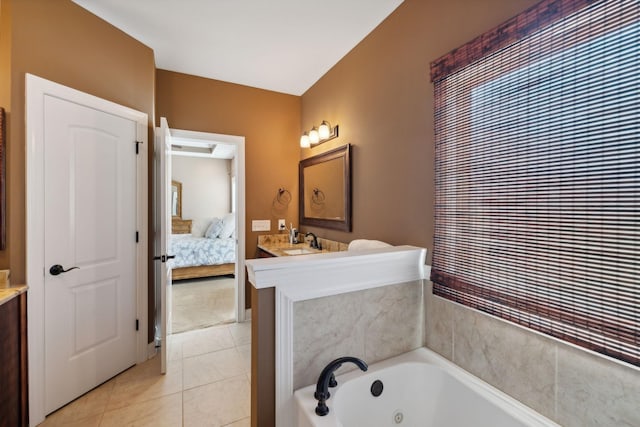 bathroom with tile patterned flooring, vanity, and a tub to relax in