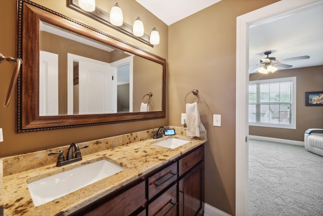 bathroom with ceiling fan and vanity