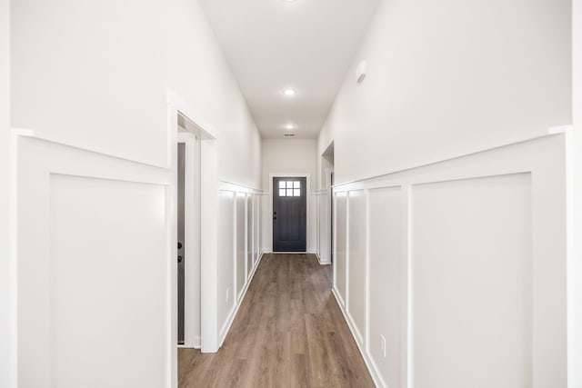 corridor with wood-type flooring