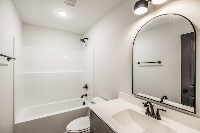 full bathroom with vanity, shower / tub combination, and toilet