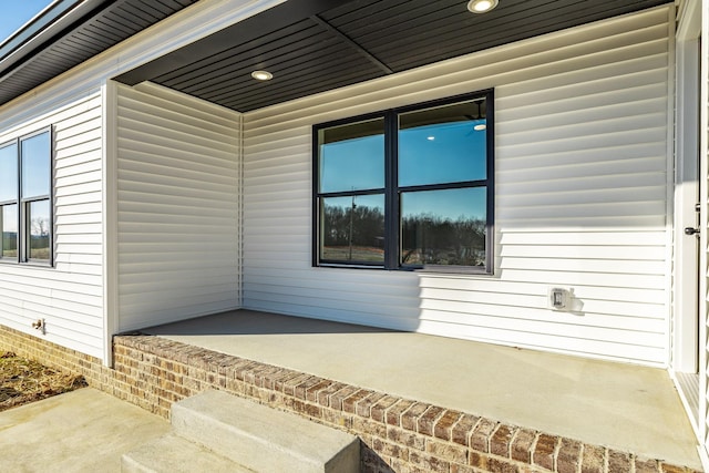 doorway to property featuring a patio area