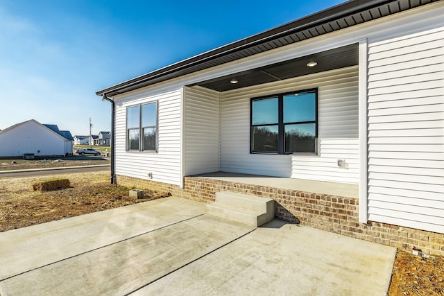 entrance to property with a patio area