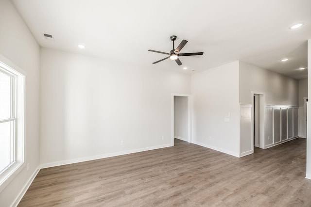 spare room featuring ceiling fan and hardwood / wood-style floors