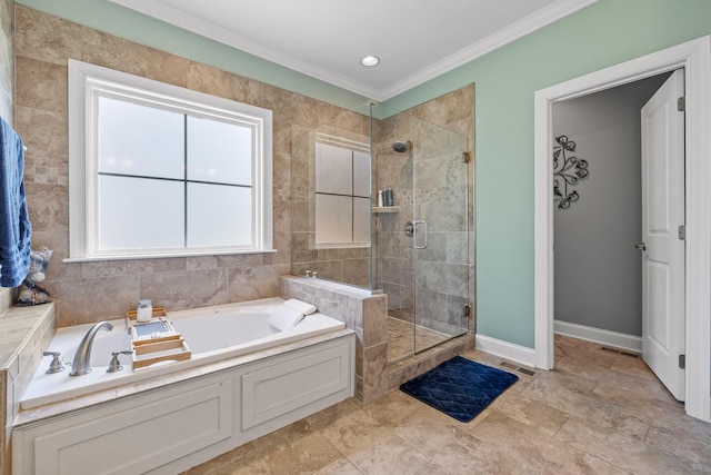 bathroom with ornamental molding and plus walk in shower