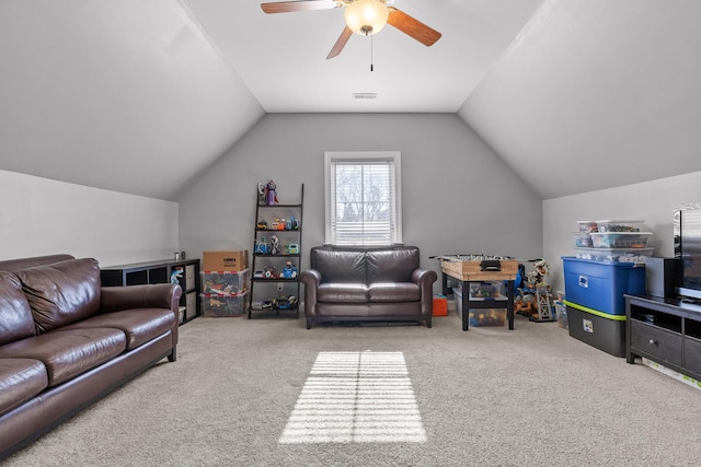 living room featuring lofted ceiling, carpet floors, and ceiling fan