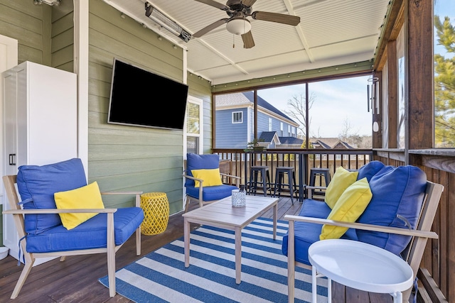 sunroom with ceiling fan