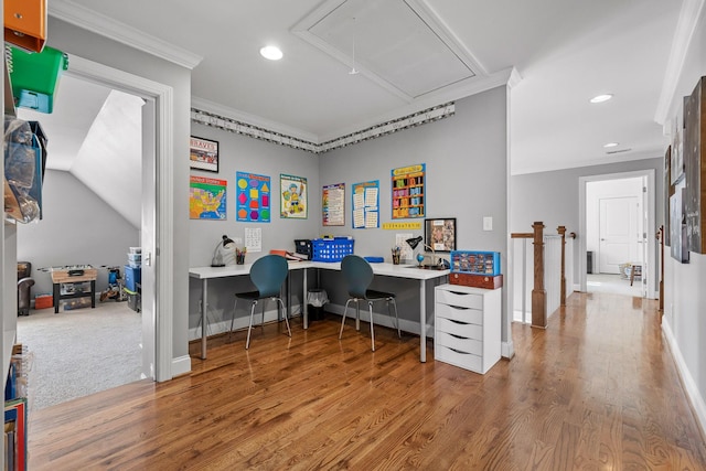 office area with wood-type flooring and ornamental molding