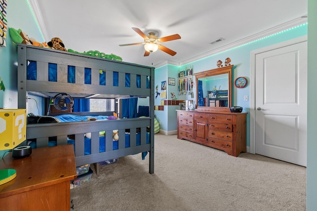 carpeted bedroom with crown molding and ceiling fan