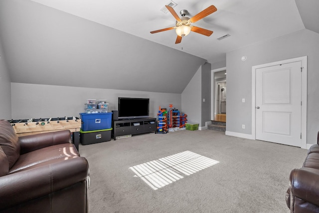 carpeted living room with ceiling fan and lofted ceiling