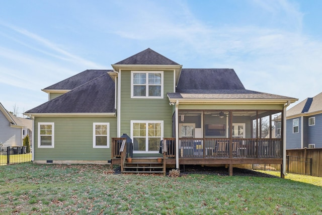 back of house with a sunroom, a yard, and a deck