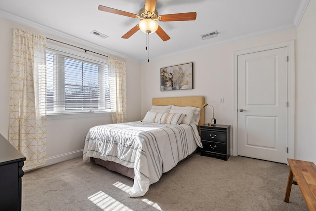 bedroom with ornamental molding, light colored carpet, and ceiling fan