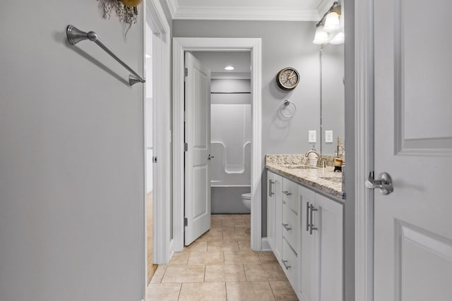 bathroom featuring tile patterned flooring, ornamental molding, vanity, and toilet