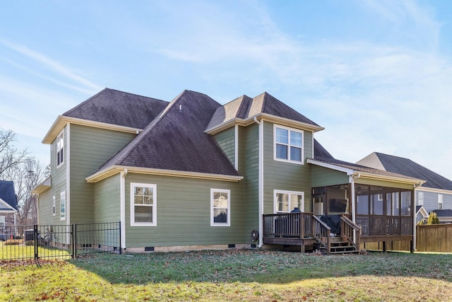 back of house with a sunroom, a yard, and a deck